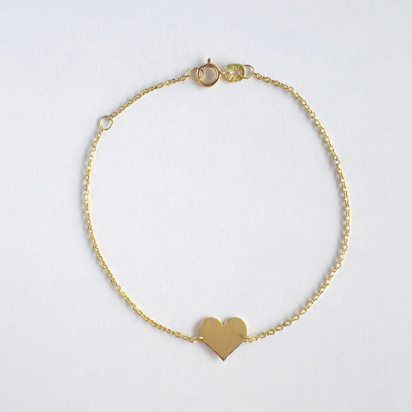 Jamila 18k gold heart charm bracelet