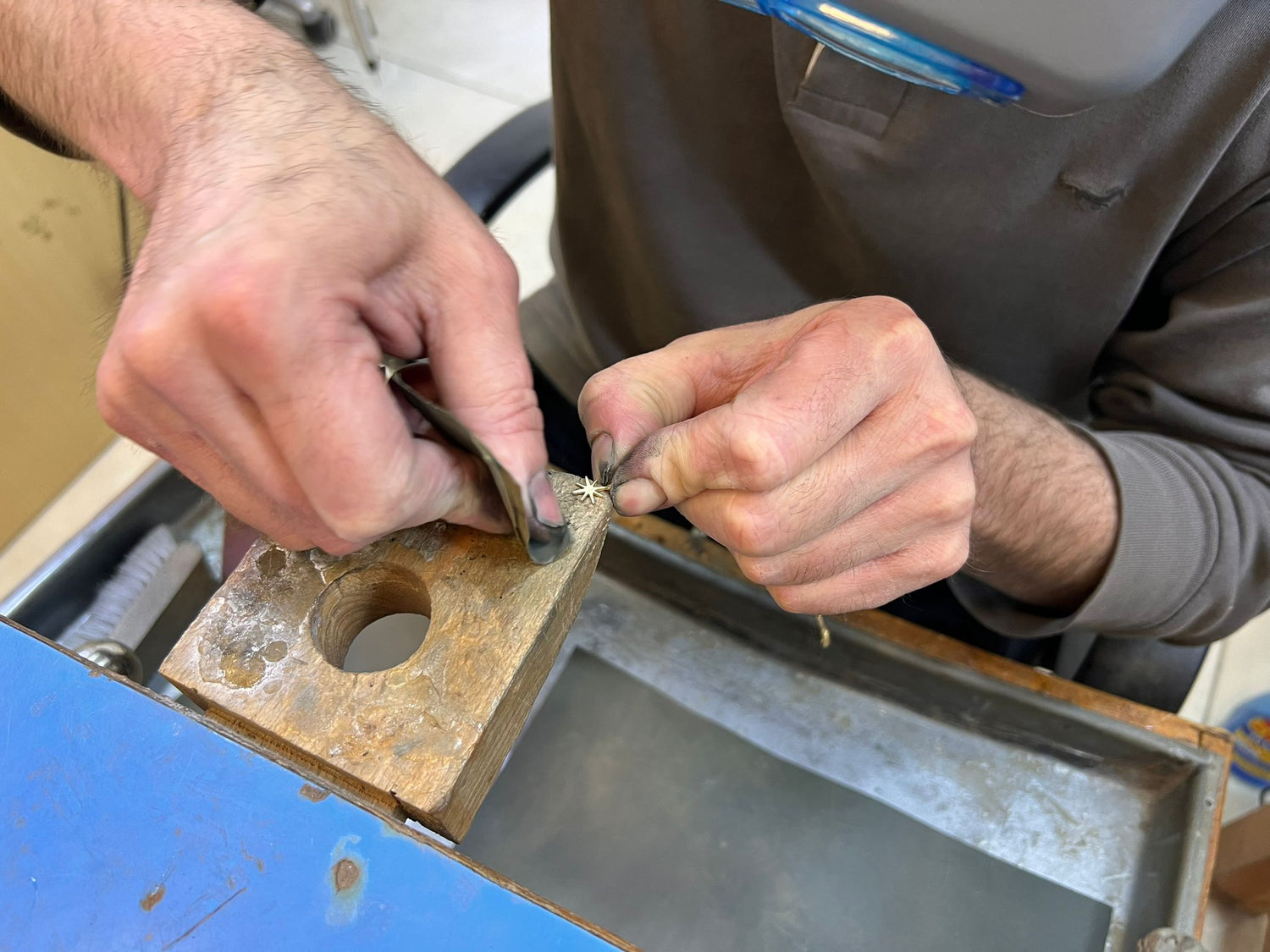 Artisan crafting Enti Jewellery pieces by hand in Lebanon, working with 18k gold at the workshop
