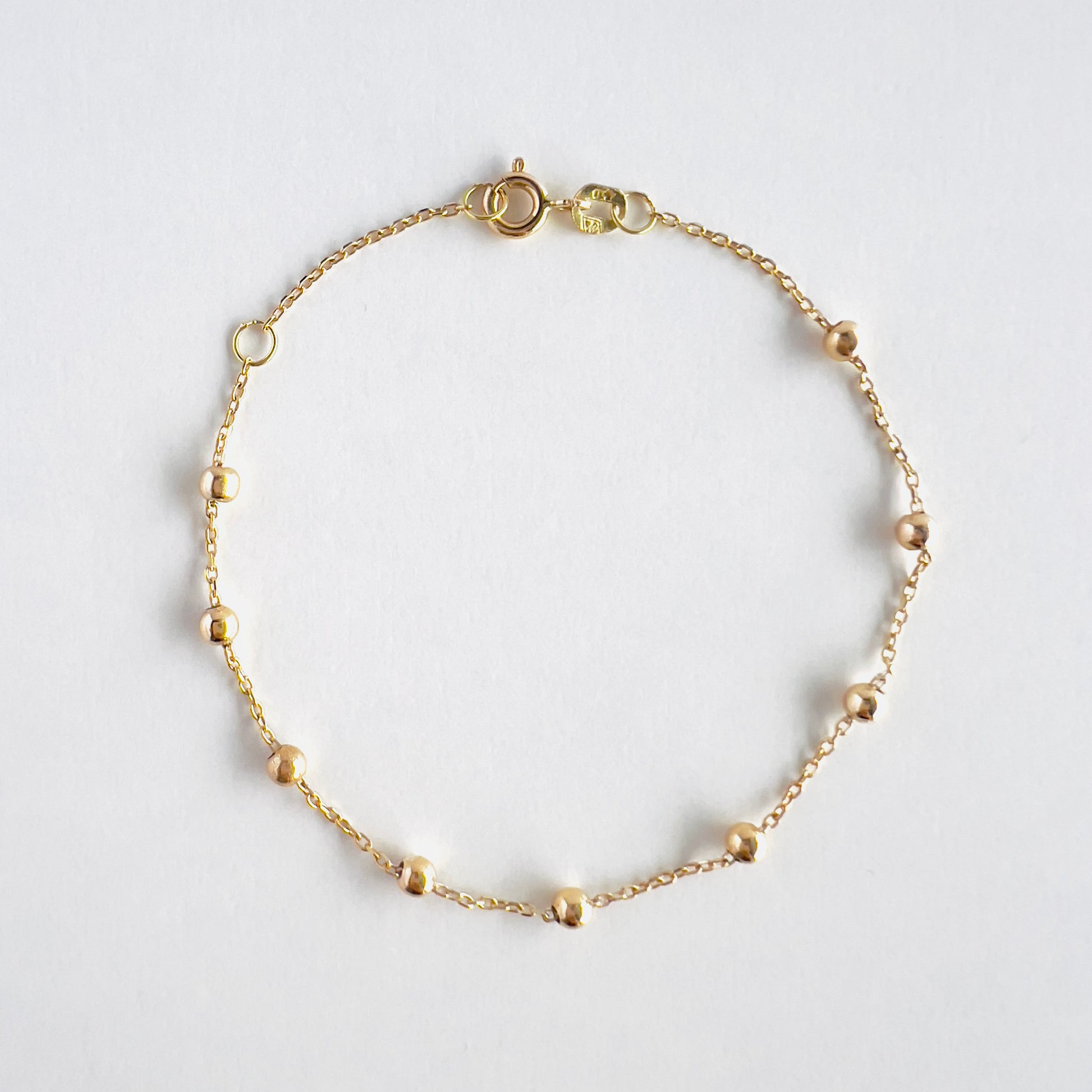 18k gold beaded bracelet in cable style chain